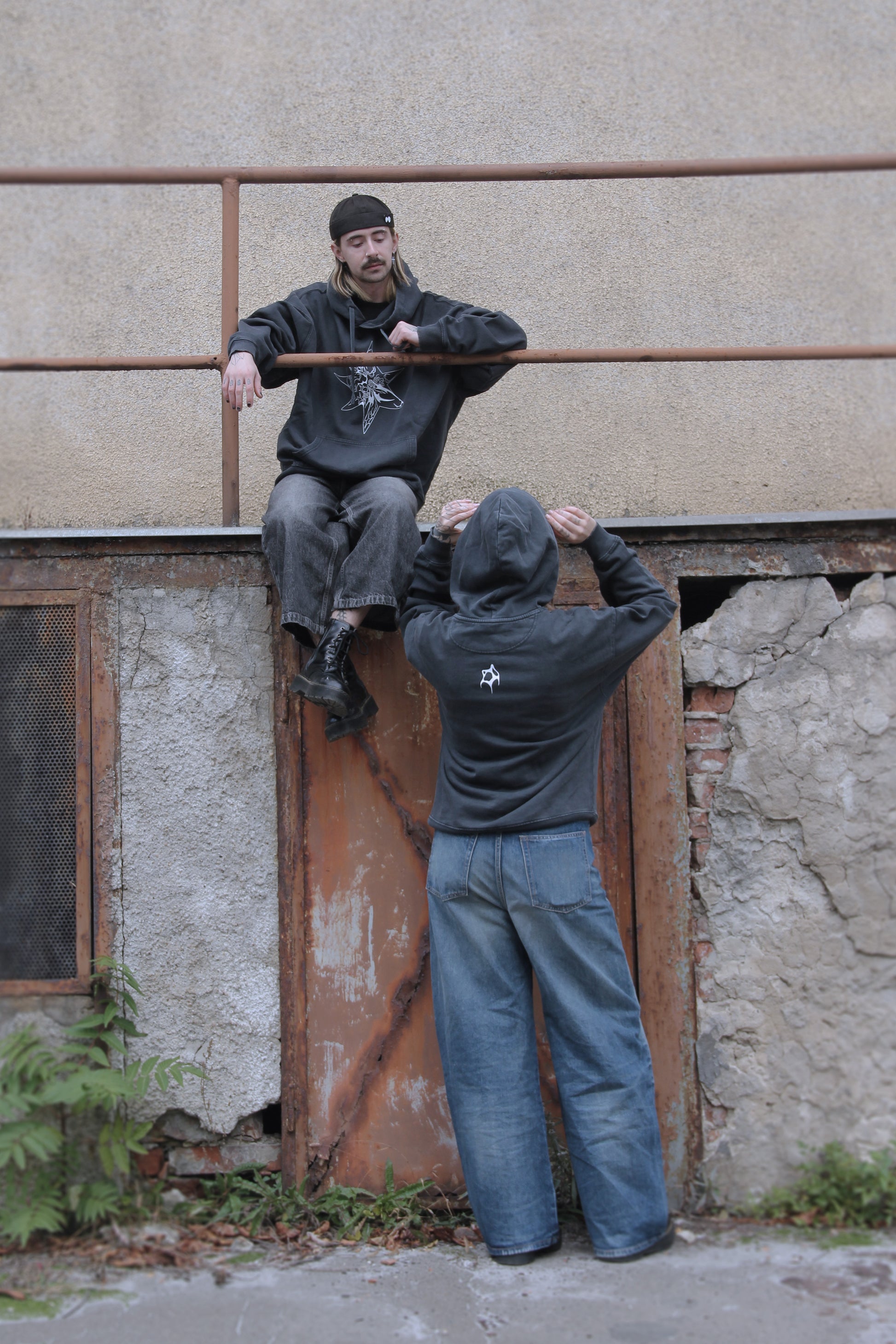 Washed-black oversized hoodie with white abstract star print on organic cotton