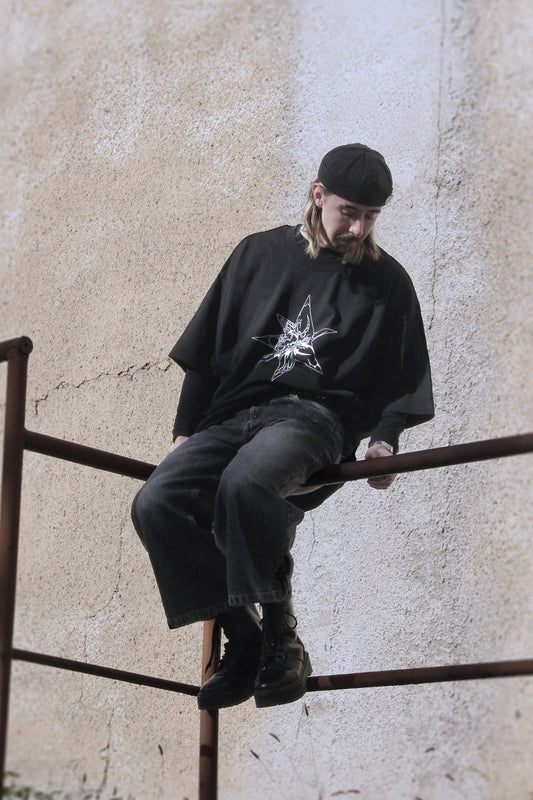 Black oversized t-shirt with white abstract star print on organic cotton