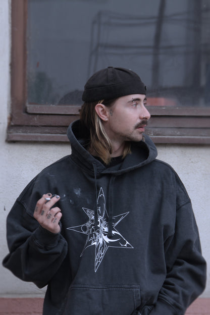 Washed-black oversized hoodie with white abstract star print on organic cotton