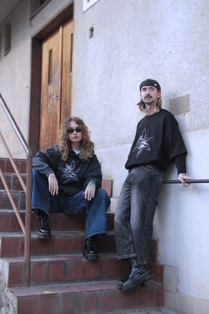 Black oversized t-shirt with white abstract star print on organic cotton