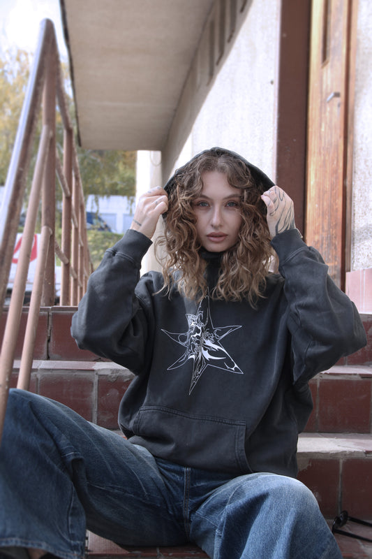 Washed-black oversized hoodie with white abstract star print on organic cotton